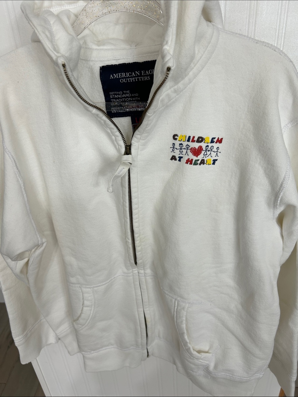 American Eagle Outfitters White Zip-Up Hoodie with Multicolor Chest Embroidery